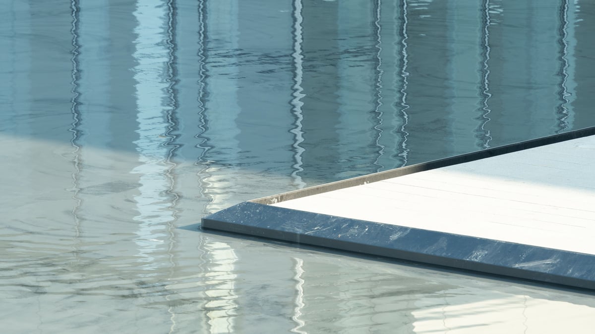 Polished self-leveling concrete floor reflecting light in a modern interior space